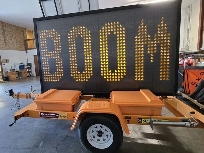 Westates Flagman portable message board trailer displaying BOOM in the Springfield yard